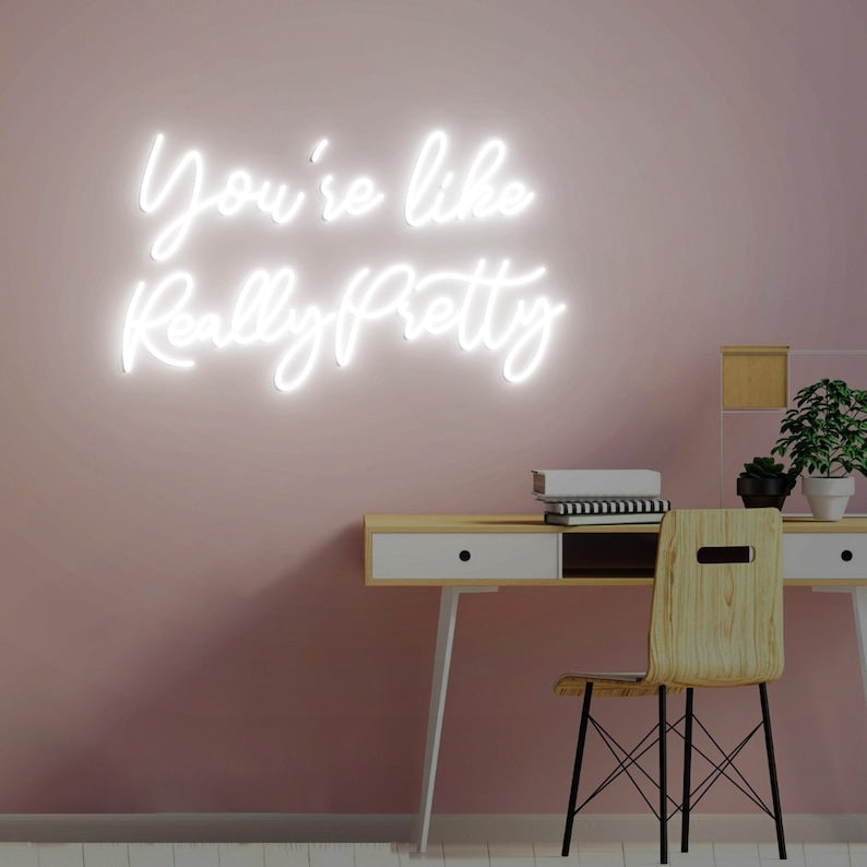 You're like Really Pretty Neon, Neon sign, Complimentary salon decor, Beauty compliment, Vibrant lighting, Stylish ambiance, Illuminated sign, Trendy neon sign, Chic beauty studio, Salon atmosphere, Compliment-inspired decor.